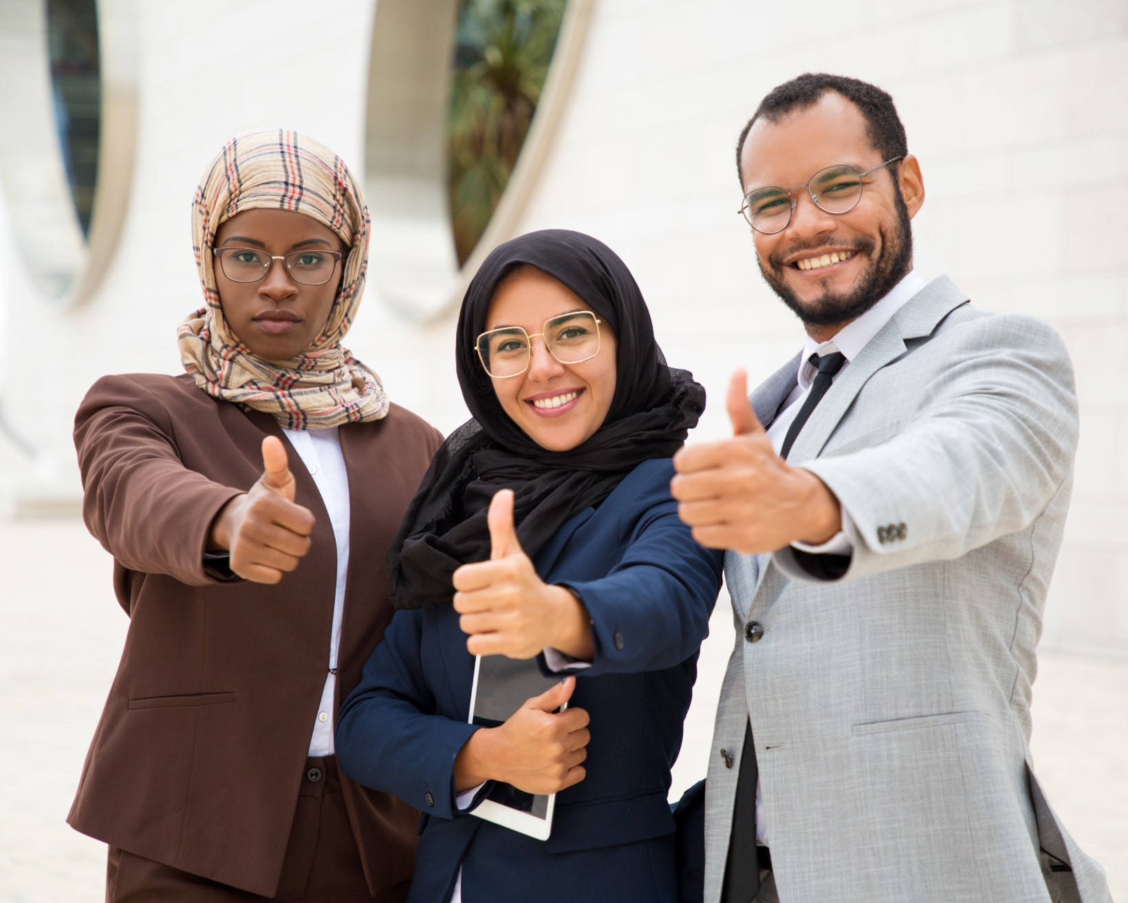 multicultural-business-group-posing-making-thumbs-up-gesture